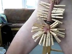 Wooden clothespins on the cock